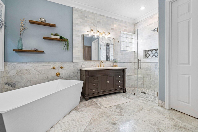 bathroom with vanity, separate shower and tub, crown molding, and tile walls