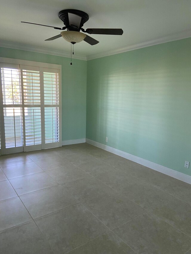 spare room featuring ceiling fan, crown molding, and light tile patterned flooring