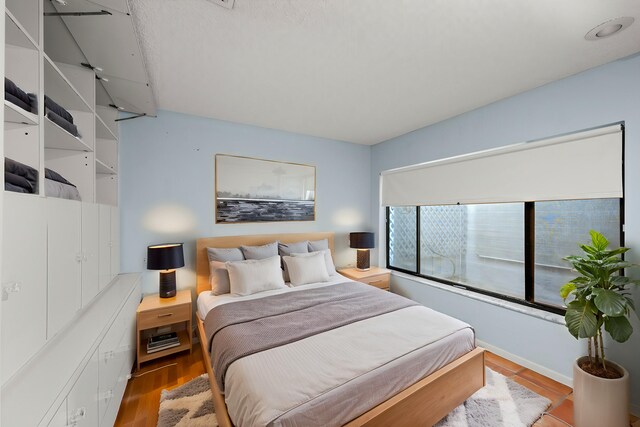 bedroom with wood-type flooring