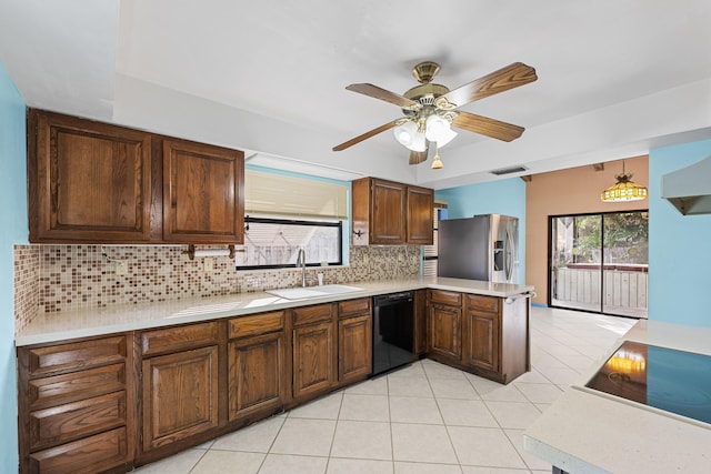 kitchen featuring dishwasher, sink, hanging light fixtures, stainless steel fridge with ice dispenser, and backsplash