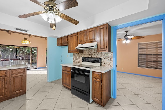 kitchen with electric range, ceiling fan, hanging light fixtures, tasteful backsplash, and light tile patterned flooring