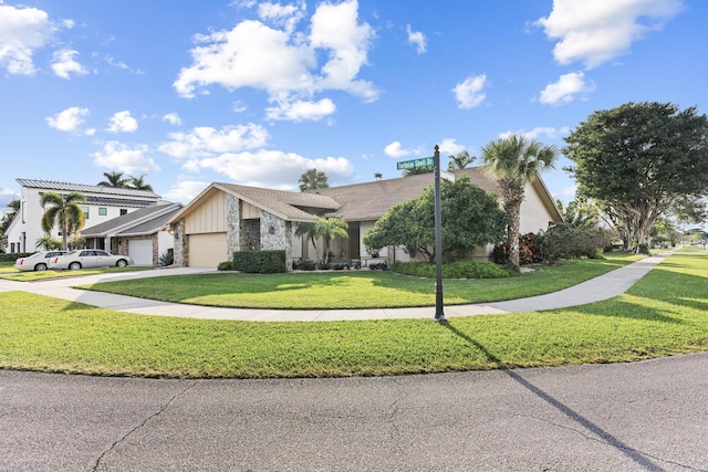 view of front of property with a garage and a front yard