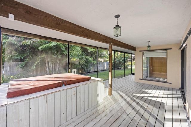 deck with a covered hot tub