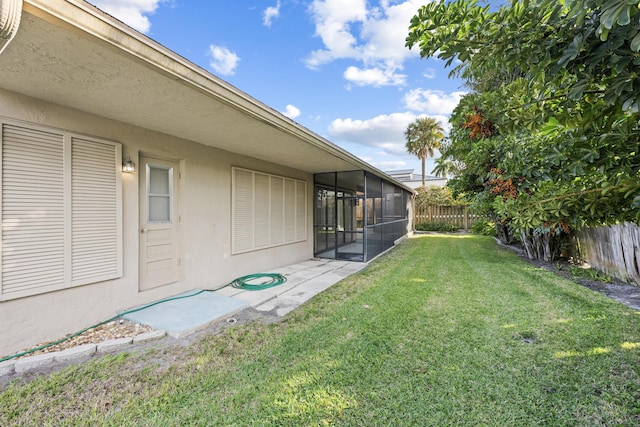 view of yard featuring a sunroom