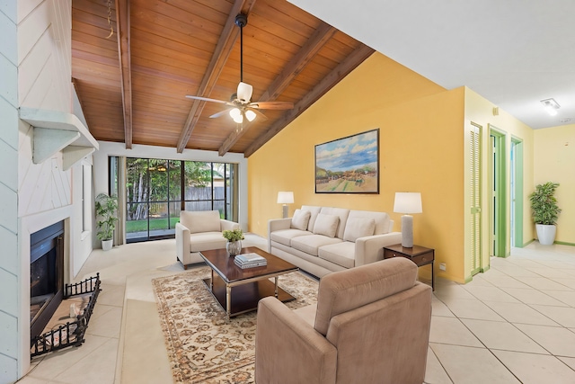 living room with ceiling fan, beam ceiling, light tile patterned floors, high vaulted ceiling, and wooden ceiling