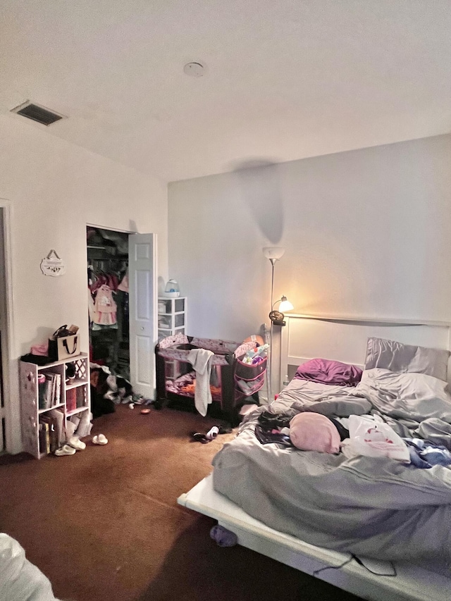 bedroom with carpet flooring and visible vents