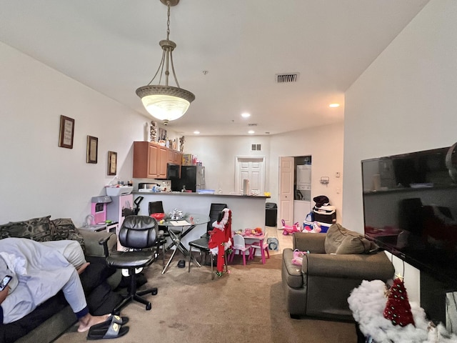 living room with light carpet, visible vents, and recessed lighting