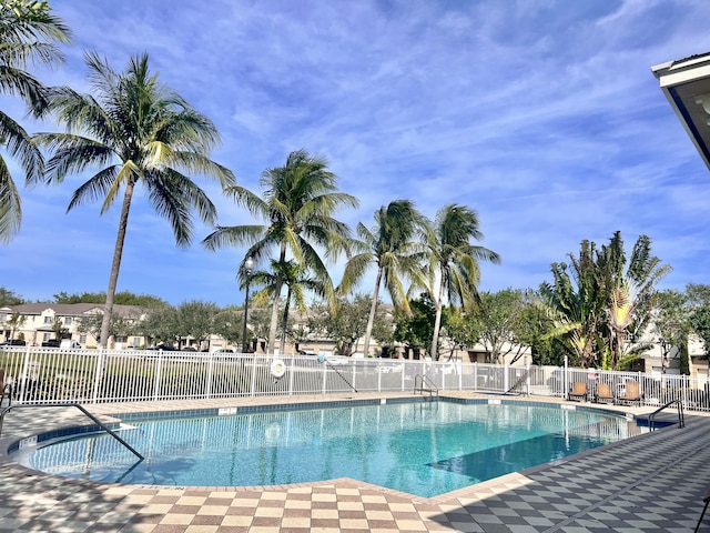 community pool featuring fence