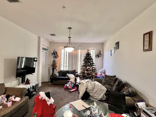 carpeted living area featuring visible vents