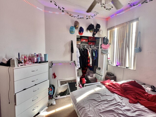 bedroom with a closet and a ceiling fan
