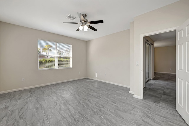 unfurnished room with ceiling fan