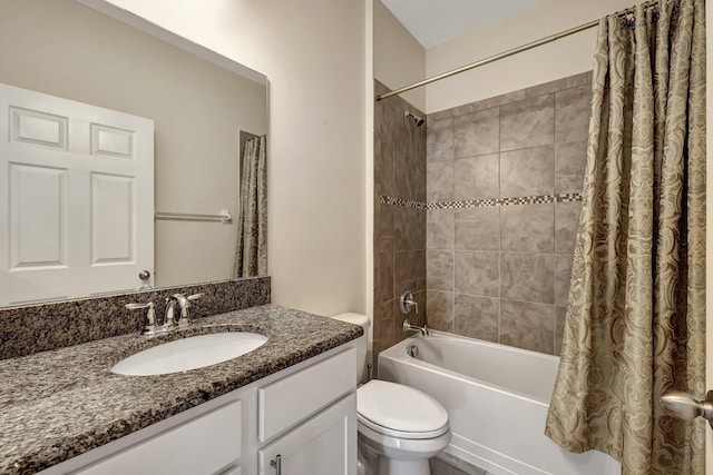 full bathroom featuring toilet, shower / tub combo, and vanity