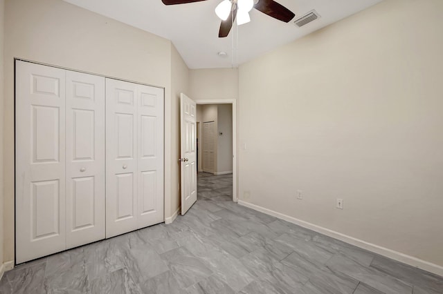 unfurnished bedroom with a closet and ceiling fan