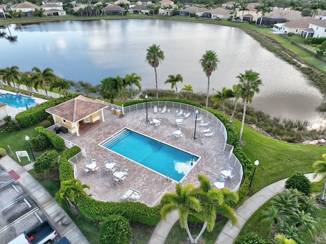 birds eye view of property with a water view