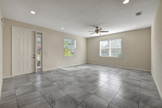 spare room with ceiling fan