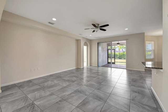 unfurnished room with ceiling fan