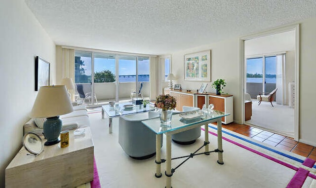 dining area featuring tile patterned floors and a textured ceiling