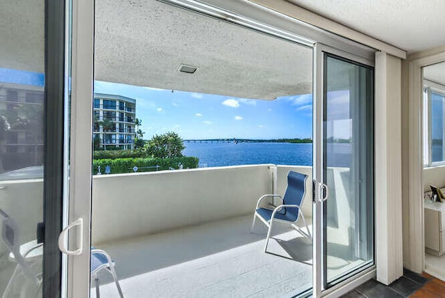 balcony featuring a water view