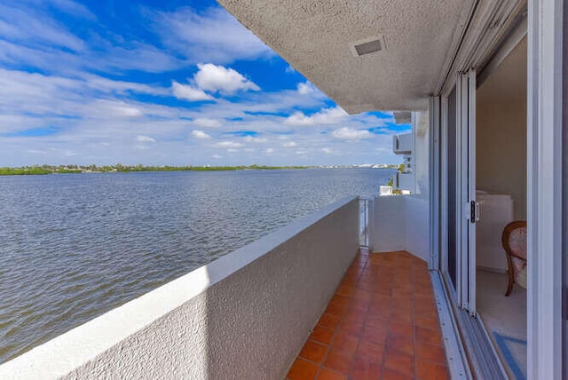 balcony featuring a water view