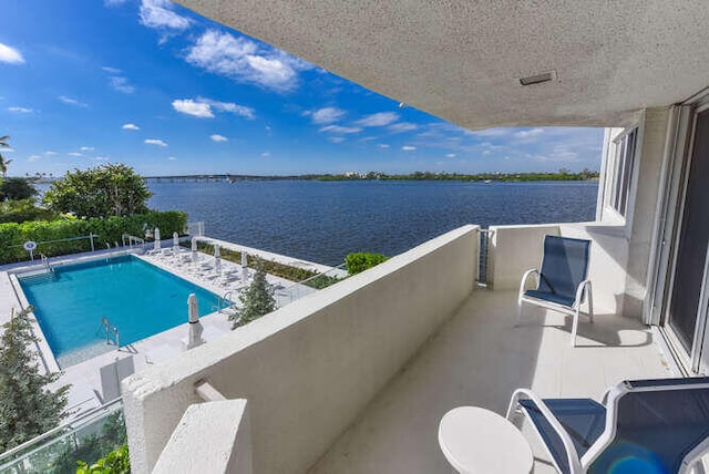 balcony featuring a water view