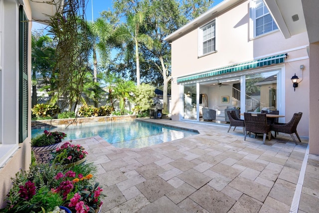 view of pool featuring a patio and pool water feature