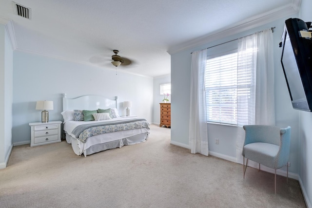 bedroom with ceiling fan, light colored carpet, and ornamental molding