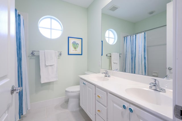 bathroom with toilet, a shower with shower curtain, vanity, and tile patterned floors