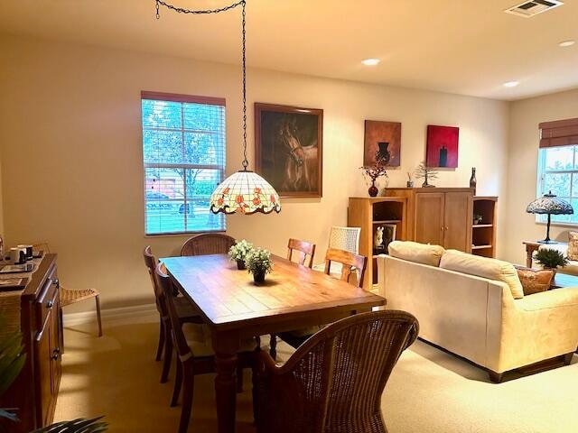 dining area with carpet flooring