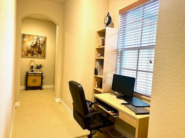 office area with light colored carpet