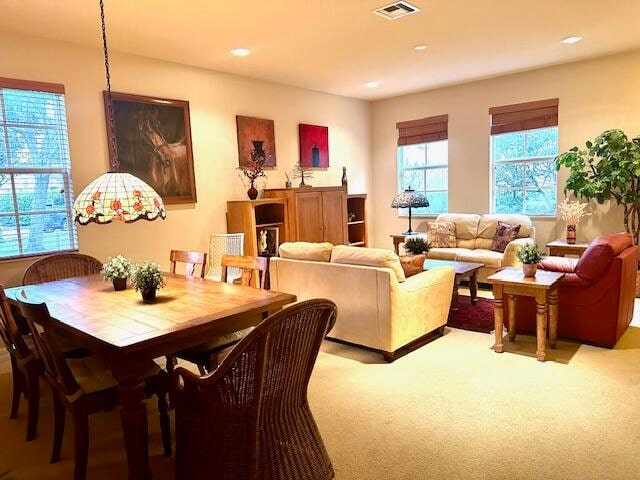 view of carpeted dining space