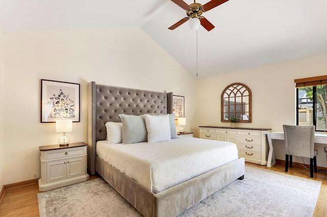 bedroom featuring ceiling fan, lofted ceiling, and light hardwood / wood-style flooring