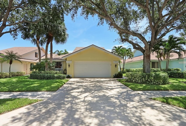 single story home featuring a garage and a front lawn