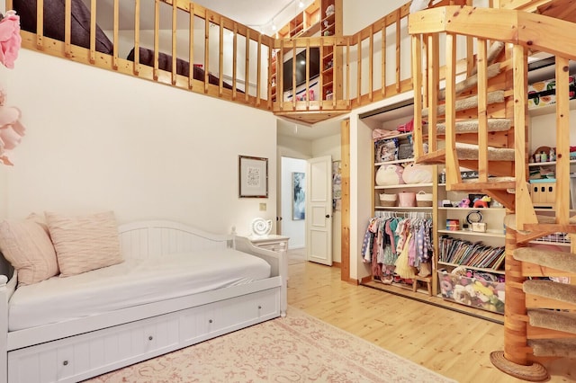 bedroom with hardwood / wood-style floors