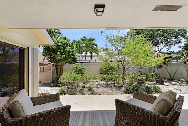 view of patio / terrace with an outdoor fire pit