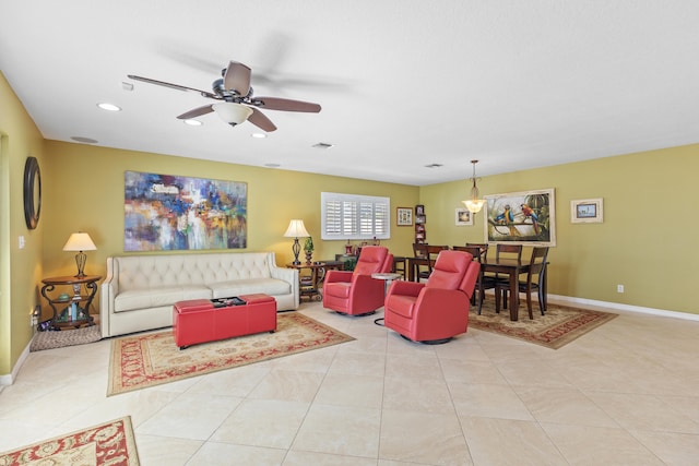 tiled living room with ceiling fan