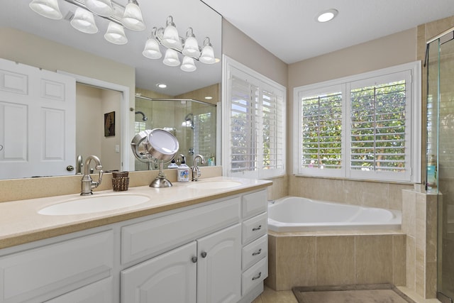 bathroom featuring vanity and plus walk in shower