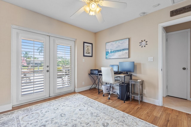 office area with light hardwood / wood-style floors, french doors, and ceiling fan