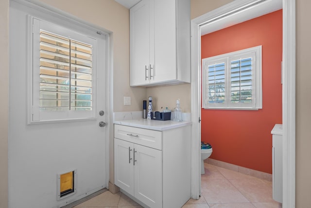 interior space with light tile patterned floors