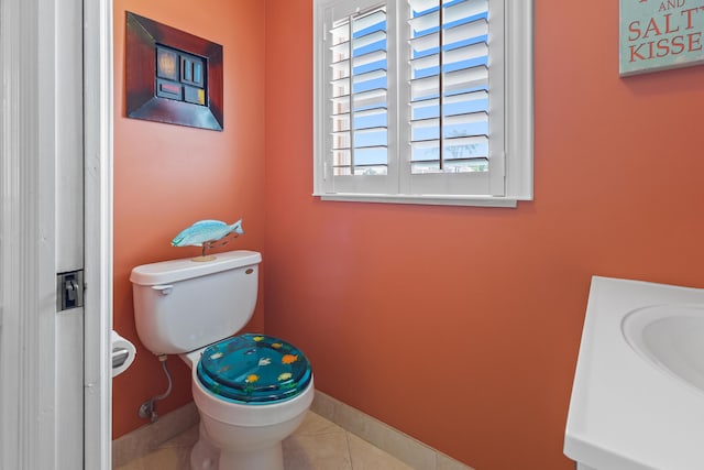 bathroom featuring tile patterned floors, toilet, and vanity