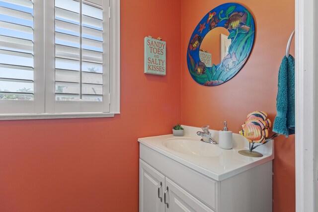 bathroom featuring tile patterned floors, vanity, and toilet