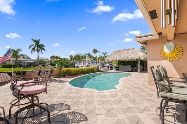 view of pool with a gazebo and a patio