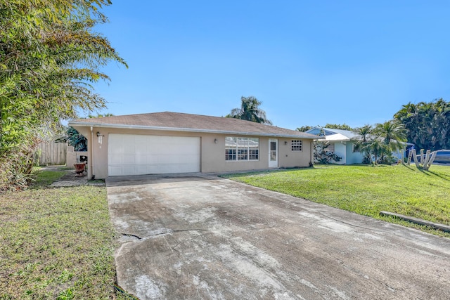 ranch-style home with a garage and a front yard