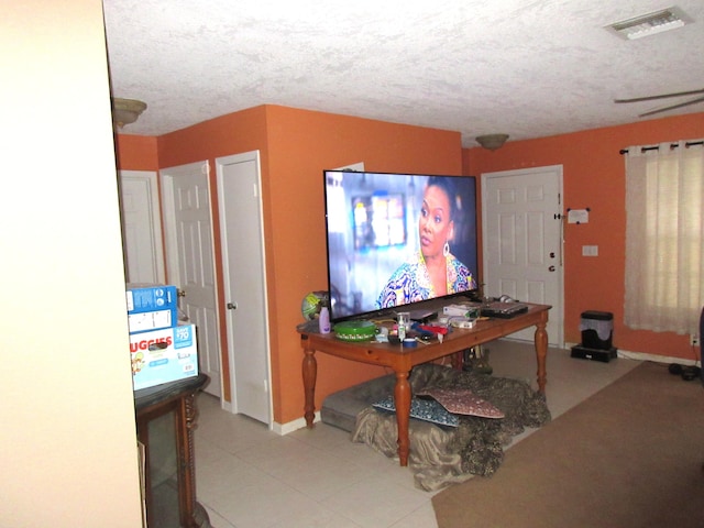 interior space with a textured ceiling