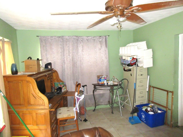 tiled office featuring ceiling fan