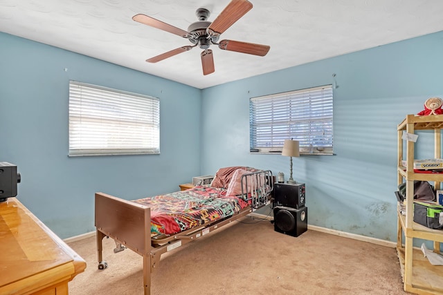 bedroom featuring ceiling fan and light colored carpet