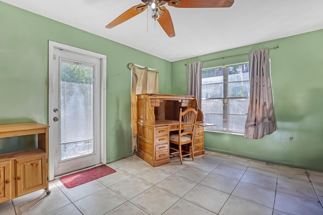 home office with light tile patterned flooring and ceiling fan