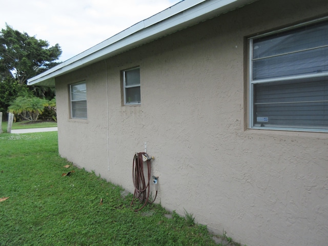 view of home's exterior featuring a yard