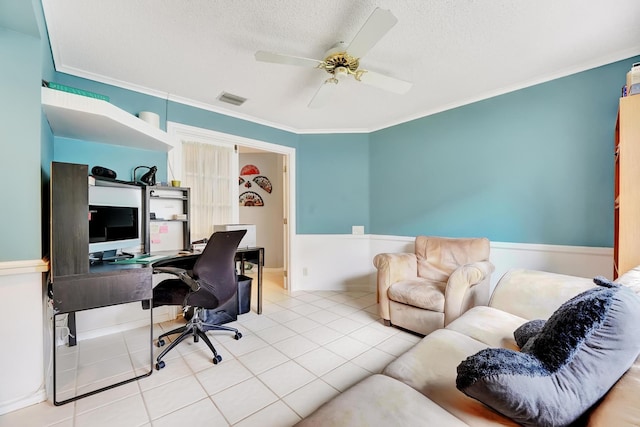 tiled home office featuring ceiling fan, a textured ceiling, and ornamental molding