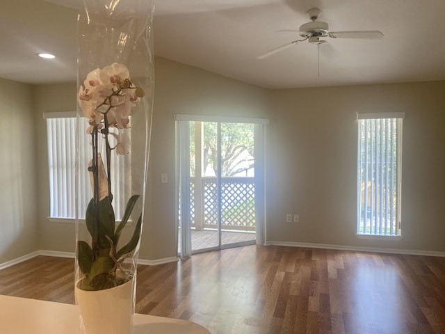 interior space featuring ceiling fan, hardwood / wood-style floors, and vaulted ceiling