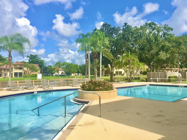 view of pool featuring a patio